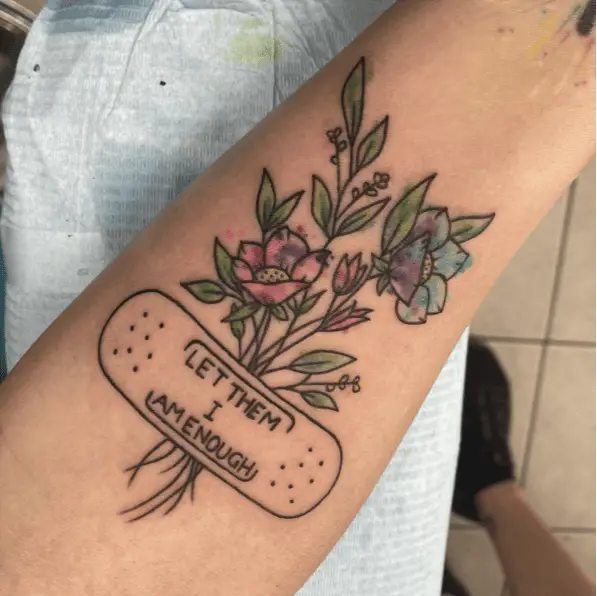 I am Enough in Band Aid With Colored Flowers Arm Tattoo