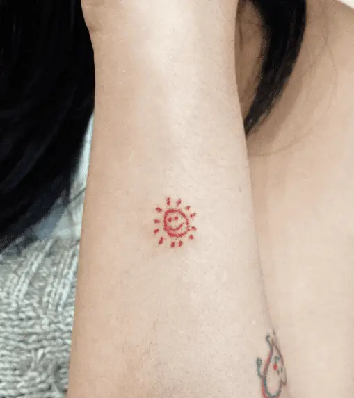 Tiny Sun Dude Forearm Tattoo 