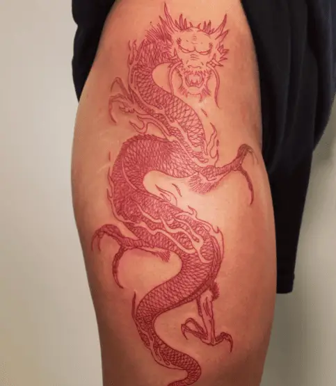 Red Ink Dragon Thigh Tattoo