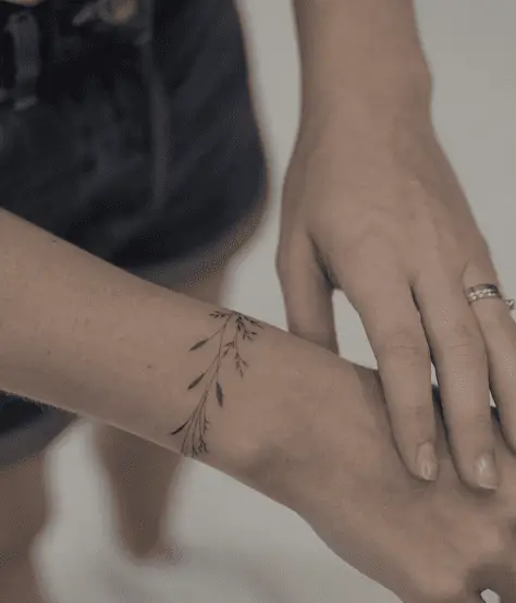 Thin Line Leaves Wrist Tattoo