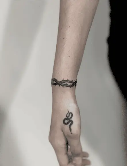 Black and Grey Rose Thorn Wrist Tattoo
