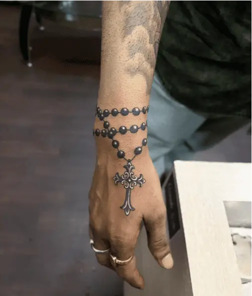 Black Beads and Silver Cross Wrist Tattoo