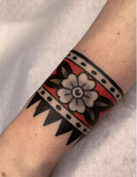 Grey Flower in Red Band with Dotted and Horns Pattern Tattoo