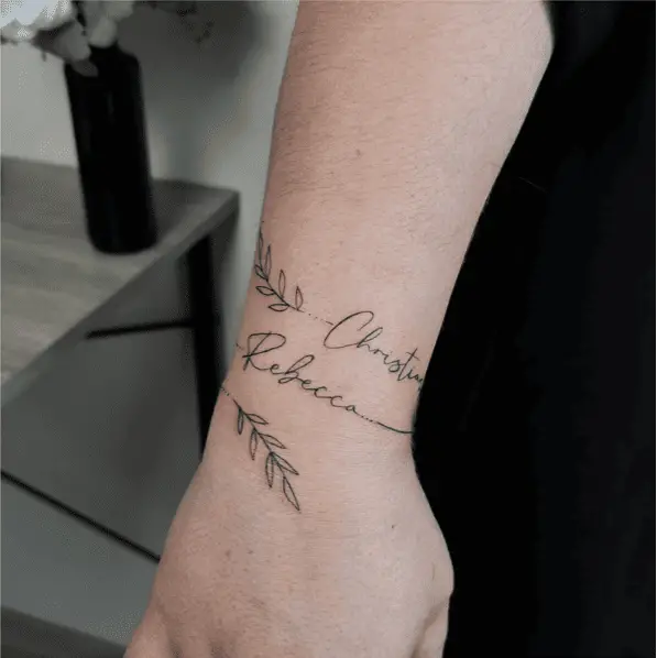 Name and Leaves Intertwined Wrist Tattoo