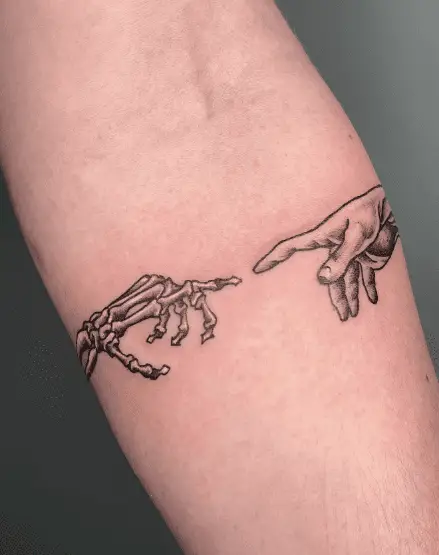 Skeleton and Human Reaching Hands Tattoo