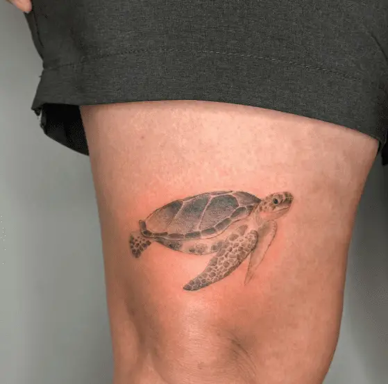 Greyish Small Sea Turtle Thigh Tattoo