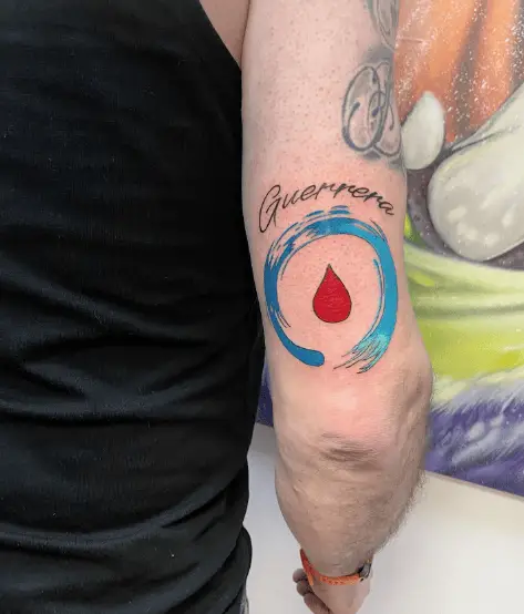 Blue Circle with Blood Drop Arm Tattoo