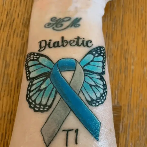 Butterfly Shaped Blue Ink Diabetic Tattoo