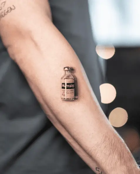 Realistic Insulin Bottle Forearm Tattoo