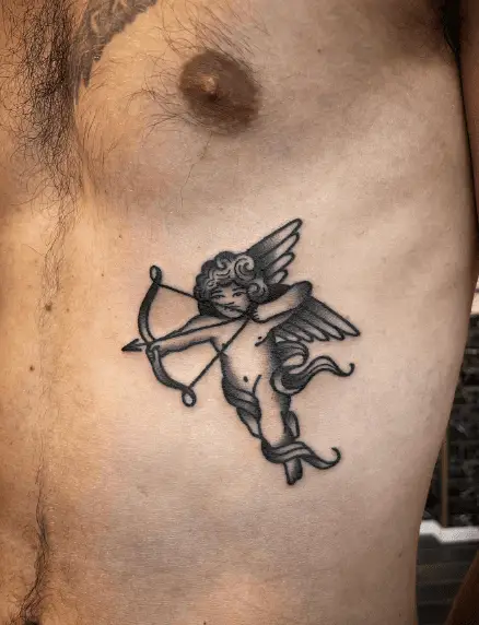 Tiny Little Traditional Cupid Rib Tattoo