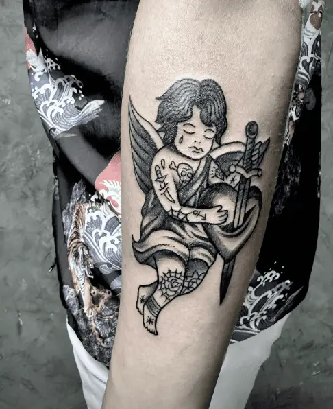 Tattoo of Crying Face Cupid Stabbing the Heart 