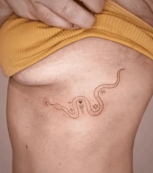 Snake and Symbols Side Boob Tattoo