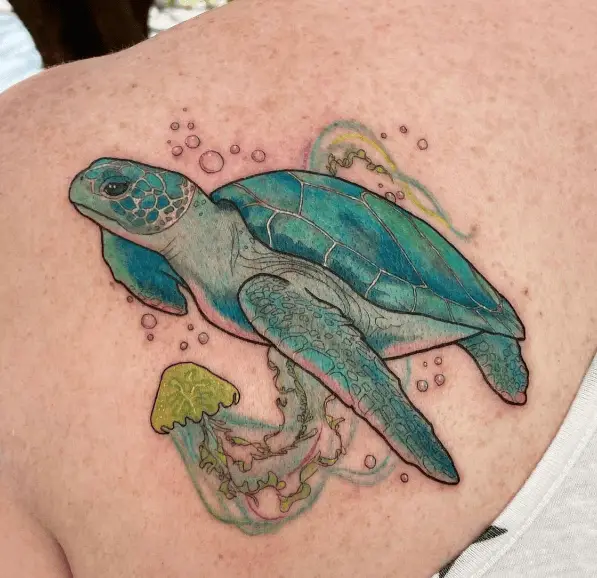 Colored Sea Turtle with Ocean Plant Tattoo