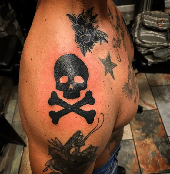 Blackwork Skull and Crossbones Arm Tattoo