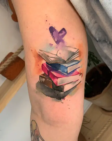 Book Stack Watercolor Arm Tattoo