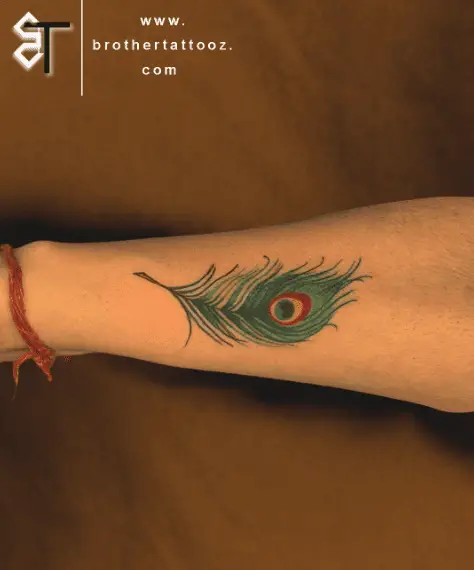 Green Peacock Feather Forearm Tattoo