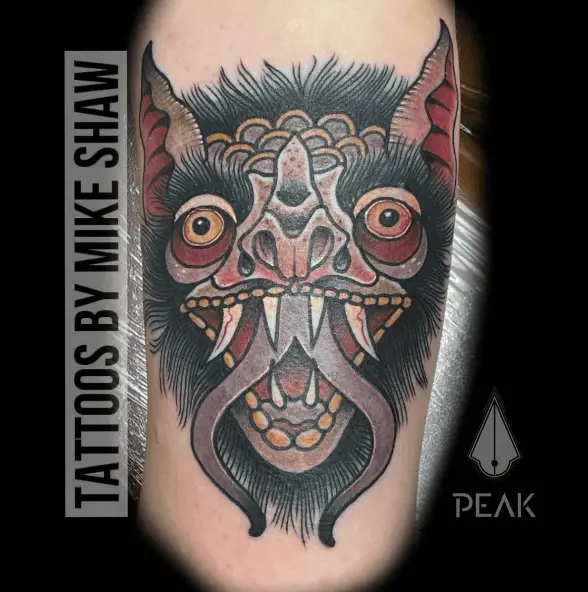 Devil Mask Tricep Tattoo