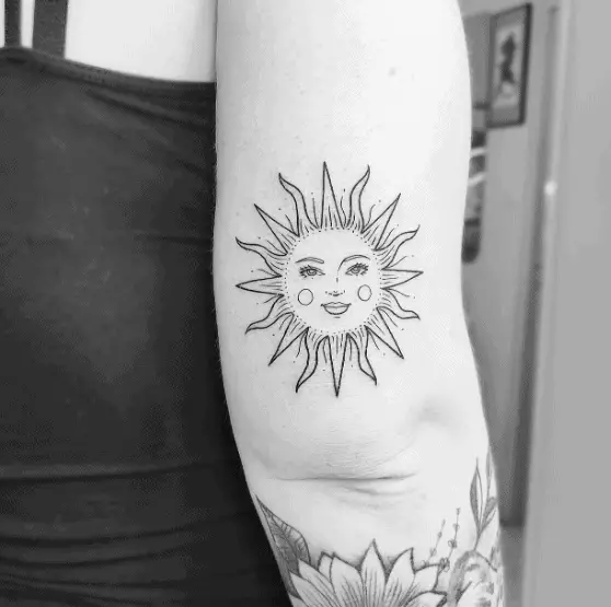 Smiling Sun Tricep Tattoo