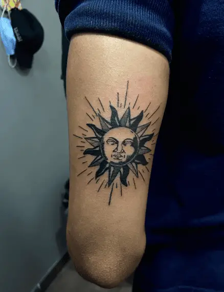 Black and Grey Sun Face Tattoo
