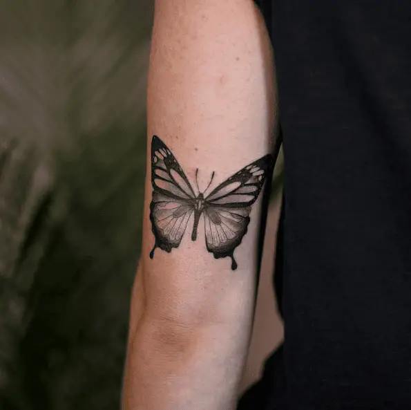 Black and Grey Dripping Butterfly Tricep Tattoo 