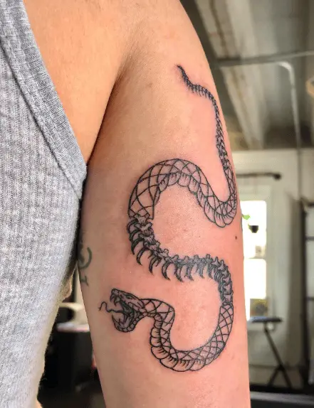 Half Skeleton Snake Tricep Tattoo