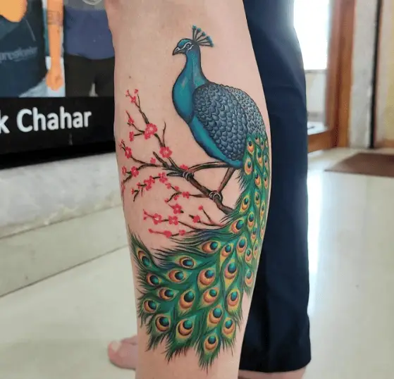 Vibrant Symphony of Colors and Intricate Details of Peacock Tattoo