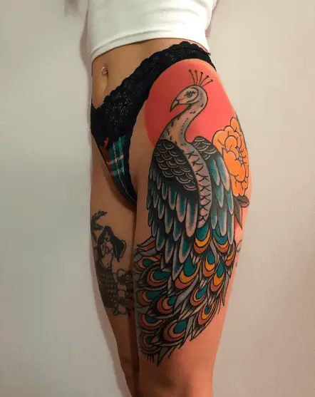 Colored Traditional Peacock Thigh Tattoo