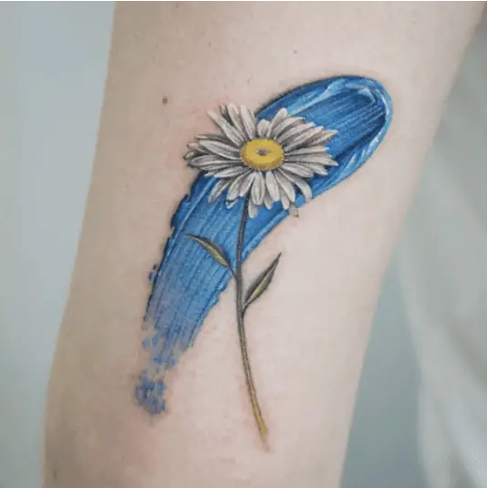Colored Daisy With Skyblue Paint Arm Tattoo