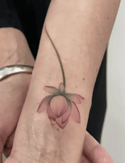 Colored Upside Down Lotus Flower Wrist Tattoo