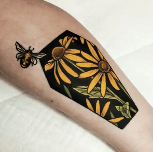 Colored Blackeyed Susan Coffin With a Little Bumblebee Leg Tattoo