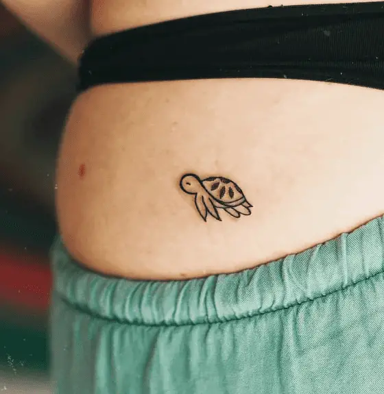 Tiny Little Sea Turtle Back Tattoo