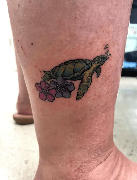 Green Turtle with Flowers Leg Tattoo