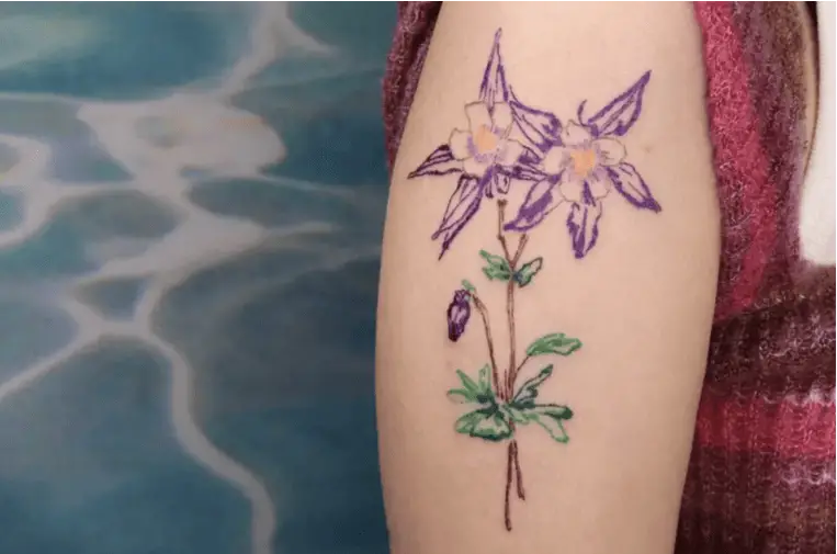 Colored Line Art Columbine Flower Upper Arm Tattoo