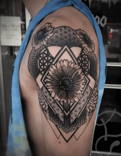 Black and Grey Blanket Flowers Mixed With Geometric Lines and Shapes Upper Arm Tattoo