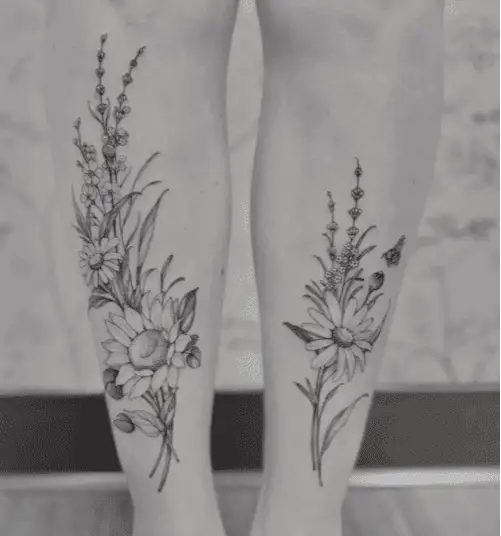 Black and Grey Mixed Wildflower With Bee on Both Legs Tattoo