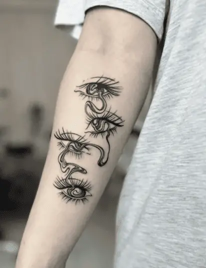 Black Ink Crying Eyes in Wavy Flow Arm Tattoo