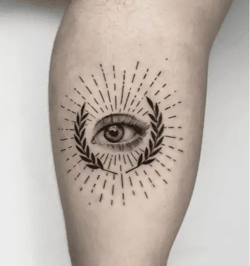 Realistic Eye With Leaves and Lines Leg Tattoo