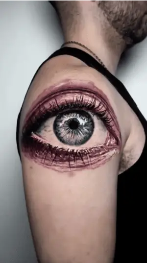 Colored Human Eye Upper Arm Tattoo