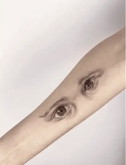 Realistic Brown and Green Eyes Arm Tattoo