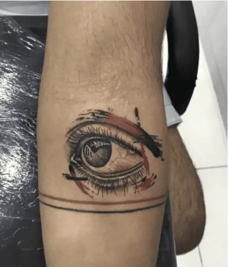 Realistic Eye With Red Brushstrokes Arm Tattoo