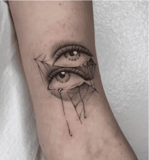 Black and Grey Watery Eyes With Spider Web Arm Tattoo