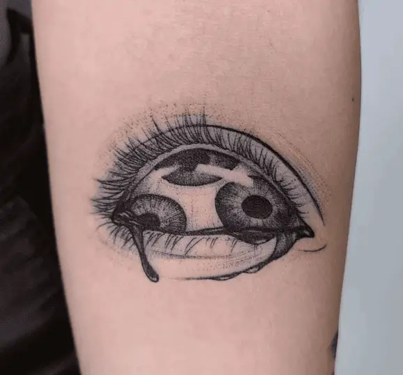Detailed Triple Pupils in a Teary Eye Arm Tattoo