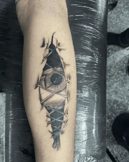 Realistic Eye Inside the Stitches Leg Tattoo