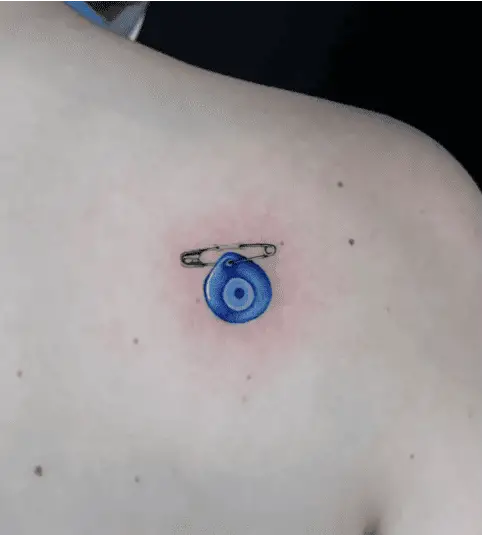 Colored Evil Eye With Safety Pin Back Tattoo
