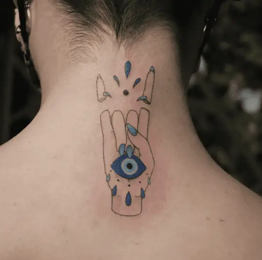 Evil Eye in Rock Hand Pose Back Tattoo