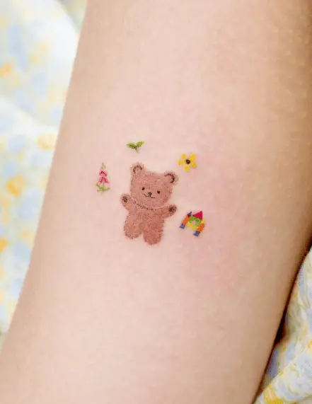 Brown Teddy with Flowers and Leaves Tattoo