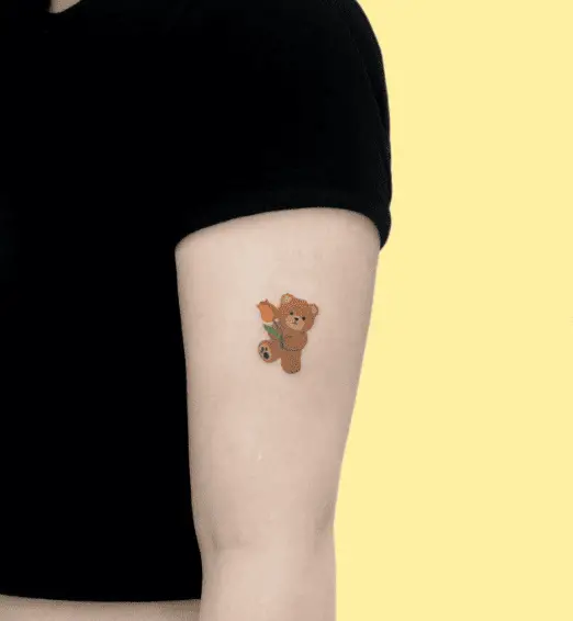 Tiny Brown Teddy with Multicolored Flowers Tattoo