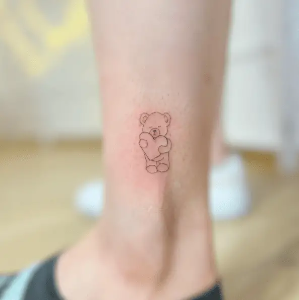 Tiny Teddy Holding a Heart Tattoo