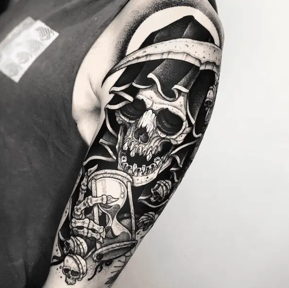 Grim Reaper Looking at the Hourglass WIth Skulls Hanging Around Detailed Tattoo