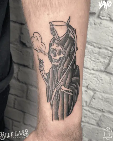 The Grim Reaper Holding a Flower as a Scythe and Smoking a Cigarette Tattoo